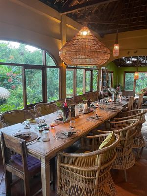 long table for group meals at Sarinbuana Eco Lodge Restaurant in Tabanan