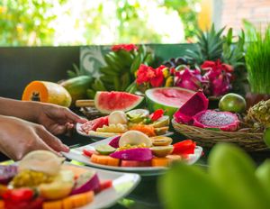 Preparing fresh fruit mandalas for our breakfast, which is included in a nights stay.  at Sarinbuana Eco Lodge Restaurant in Tabanan
