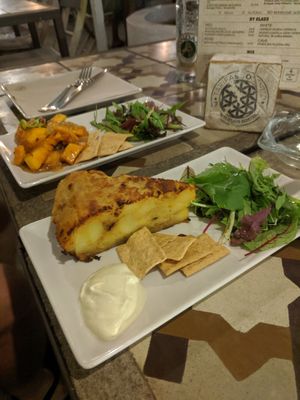 Tapas: tortilla de patata and pumpkin in sweet and sour sauce at Tarifa EcoCenter in Tarifa