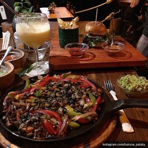 Veggie fajitas and soy burger (without dairy)  at Spirulina in Puerto Escondido