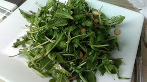 arugula w/ white beans, croutons (omitted on request), red onion, and roasted garlic maple dressing. Small. Salad at Garden Cafe of Woodstock. July 2021.  at Garden Cafe of Woodstock in Woodstock