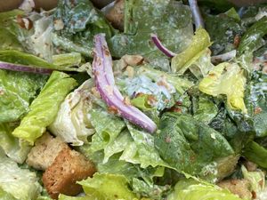Caesar Salad with red onions, croutons and almonds  at Garden Cafe of Woodstock in Woodstock