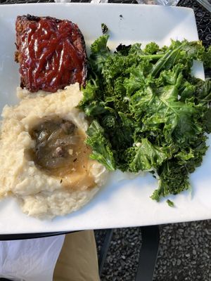 Lentil loaf with mashed potatoes gravy and sautéed greens  at Garden Cafe of Woodstock in Woodstock