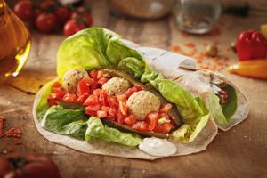 Amaizing Veggie Wrap - red lentil balls with sesame, home made tahini sauce with pickles, tomatoes, lettuce and a sourdough flat bread at Sara Green - Vegan Bistro in Bucharest