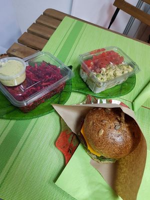Beetroot salad, pasta salad, and Cheeseburger at Sara Green - Vegan Bistro in Bucharest