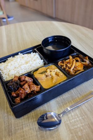 Bento box with stir fried gungpao mushroom, braised QQ tofu and nyonya curry potato with tofu puff at Greendot - Vivocity in Central Singapore