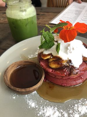Berry pancakes and a green juice  at Cafe Organic in Canggu