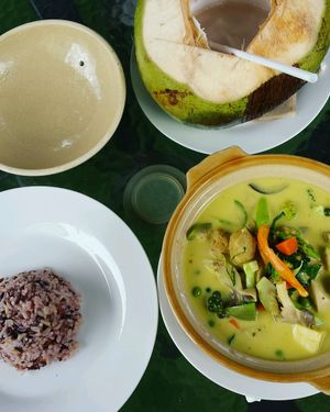 Thai green curry and fresh coconut at House of Joy in Bangkok