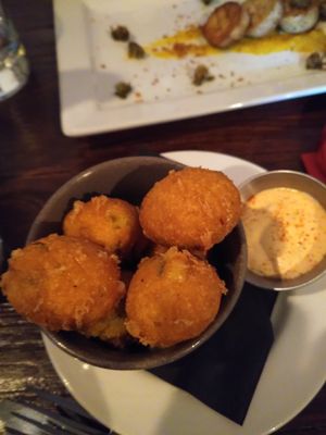jalepeno hush puppies with mushroom scallops in background at Harmonium in Edinburgh