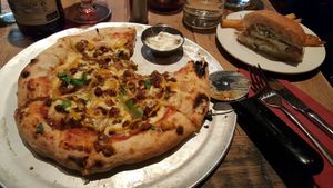 Philly cheese steak pizza and half tofish burger at Harmonium in Edinburgh