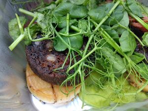 Mushroom scallops with black pudding sausage and mushy green peas (in takeout box). Still tasted perfect! at Harmonium in Edinburgh