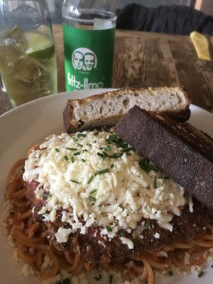 Chicken parmigiana with garlic bread  at Harmonium in Edinburgh