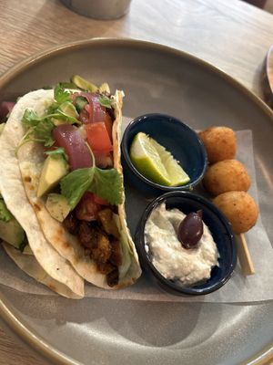 Tacos with BBQ ”meat”, avocado, salad and rice cheddar croquettes  at Happy Bean in Prague