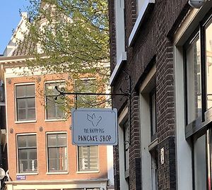 Sign out front    at The Happy Pig Pancake Shop in Amsterdam