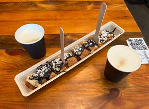 Vegan pancake with apple and chocolate sauce and 2 cappuccino with oat milkk  at The Happy Pig Pancake Shop in Amsterdam