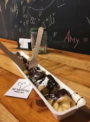 Vegan pancake with banana and chocolate hazelnut sauce (all vegan)  at The Happy Pig Pancake Shop in Amsterdam