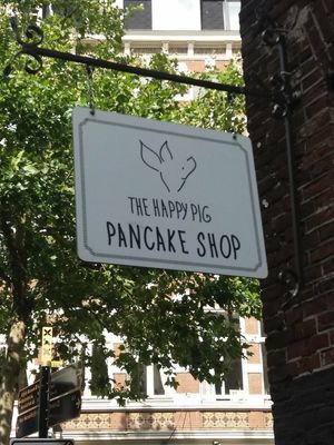 Sign at The Happy Pig Pancake Shop in Amsterdam