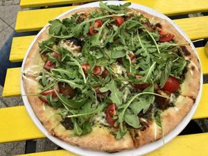 Pesto pizza with cherry tomatoes, seitan and rocket  at Vegan Port Pizza & Restaurant in Gdansk