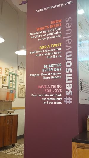 a sign in the store.  at Semsom Eatery in New York City