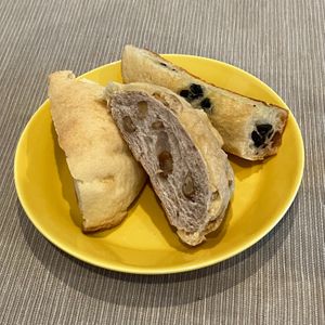 Melon-pan; Melon-pan with walnuts; Garlic Focaccia with olives at Vegetarian Beast in Tokyo