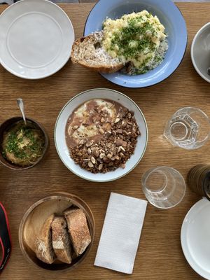 Egg, humus, sourdough bread, granola.  at Epoca Porto in Porto