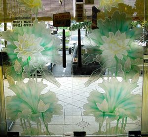 Looking out, hours on door. at Thank Food Vegetarian in Kuching