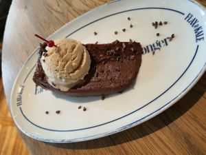 2 layers chocolate cake with hazelnut ice cream - really good! at Flax & Kale - H&M in Barcelona
