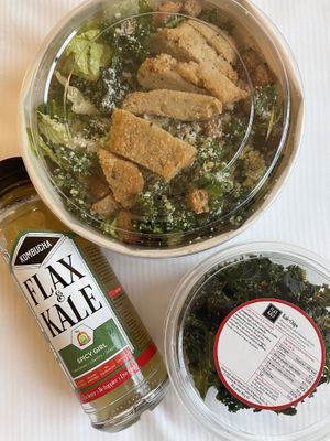 Grab and go - “plant based” chicken caesar, kale chips, and kombucha  at Flax & Kale - H&M in Barcelona