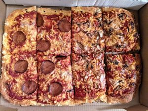 8 slice pizza, half with pepperoni, half with mushrooms and onions ($24) at Fry Baby Donuts in Buffalo