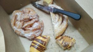 Apple fritter, orange chocolate donut, cinnamon bun at Fry Baby Donuts in Buffalo