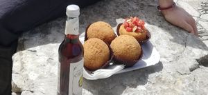 Vegan arancini and chinotto at La Tonda Fritta in Erice