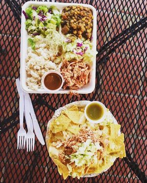 Hot plate with coconut rice, pineapple coleslaw, jackfruit bbq, salad greens and hot lava sauce (sweet chili).  at Loko Wraps in Kailua Kona
