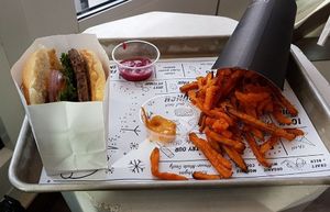 Burger with sweet potato chips at By Chloe - Fenway in Boston