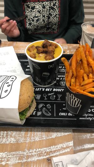 guacamole burger and sweet potato fries at By Chloe - Fenway in Boston
