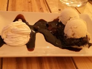 vegan brownie with vanilla ice cream at Masa Madre in Madrid
