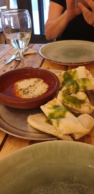 Cheese, tomatoes and garlic bread- so delish! at Masa Madre in Madrid