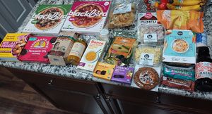 The character limit is too low to detail all items. It is assorted groceries of snacks, frozen items, sweet treats, and a drink to quickly summarize. at Food Fight Vegan Grocery - Halsey St in Portland