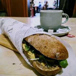 Greenie sandwich with some kind of avocado mayonnaise/spread, basil and cheese. at Sultans in Antwerpen
