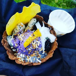 Purple Dragon with vegan salted ube ice cream, granola, tapioca pearls, blackberries, toasted coconut, red mung beans, dehydrated mango chip, and dragon fruit slices in a edible waffle bowl.  at Ube Kitchen - Food Stall in Brooklyn