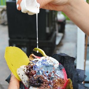 Dark dragon with vegan coconut activated charcoal ice cream, ground flax seeds, cacao nibs, blackberries, dragon fruit, and a mango chip at Ube Kitchen - Food Stall in Brooklyn