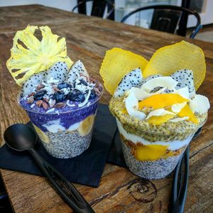 Ube chia pudding with sliced banana, coconut cream, blueberries, cacao nibs, dragon fruit, and a pineapple chip at Ube Kitchen - Food Stall in Brooklyn