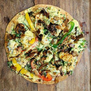 8" vegan tortilla pizza with adobo coconut Tofurky, bell peppers, two-cheeses, alfalfa sprouts, and dehydrated mushrooms/coconut flakes at Ube Kitchen - Food Stall in Brooklyn