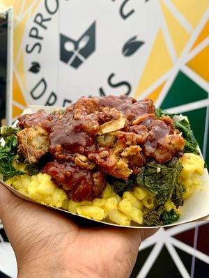 Mac Bowl (Crispy BBQ Chick’n, garlicky greens, truffle mac n’ cheese)  at Sprouting Dreams in Dayton