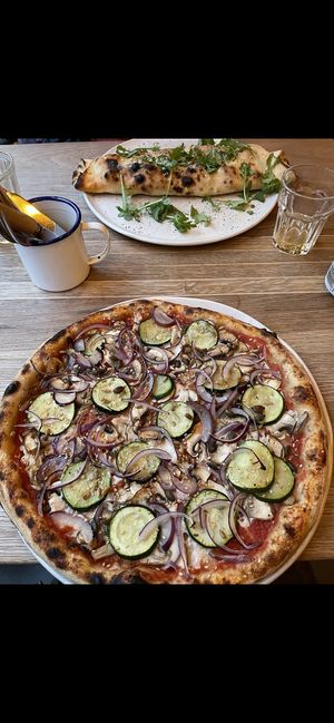 Garlicky (vegan) and calzone (vegetarian)  at The Flat in Exeter