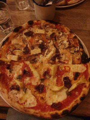 Half a salty and half a I think smoky pizza at The Flat in Exeter