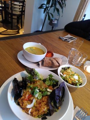 Yellow courgette soup, salad and Jambalaya at Logica Cafe Restaurant in Leiden