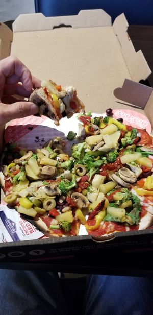 Yum! Lots of fresh ingredients for vegans. The vegan cheese is fine, but they didn't need to eat more vegetables! 😃 at 1000 Degrees in Sioux City