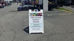 Entrance sign at Marymount Farmers Market in Arlington