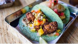 Cauliflower tacos : pumpkin purée, Achiote Cauliflower, orange salsa.  at Lucha Verde in Vancouver