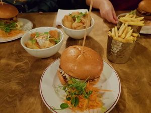 satay burger, facon poppers, banana blossom goujons and fries at Two Wolves Kitchen in Brighton